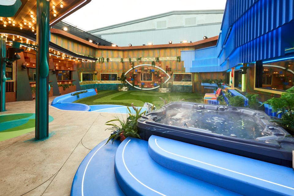 a large house with a hot tub in the middle