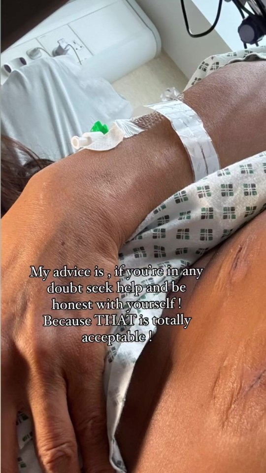 a woman in a hospital gown with a needle in her arm