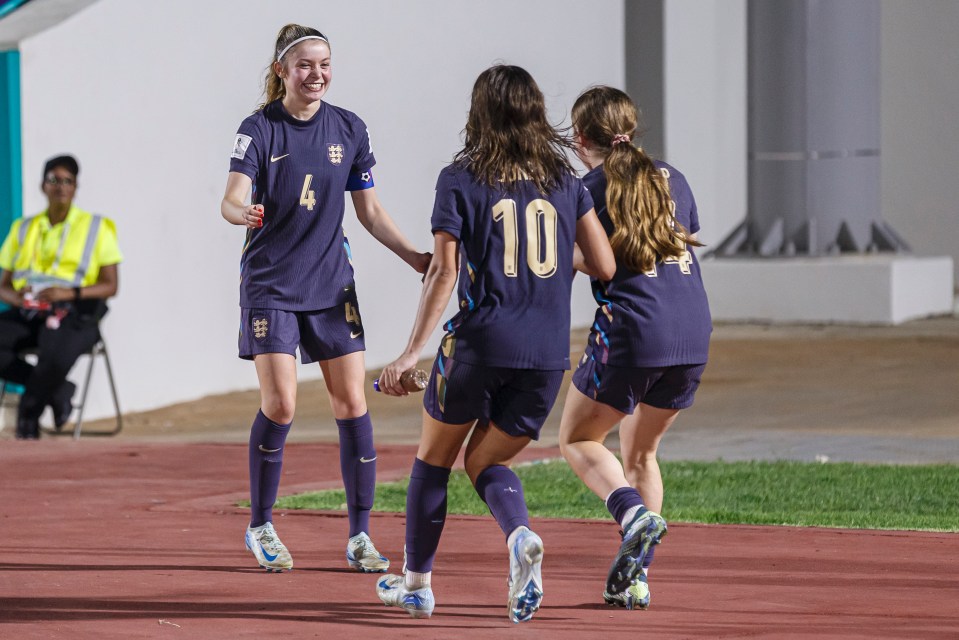 a soccer player with the number 10 on her jersey