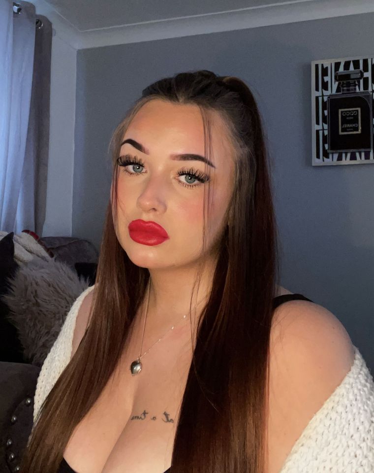 a woman with a tattoo on her chest that says " i want to be "
