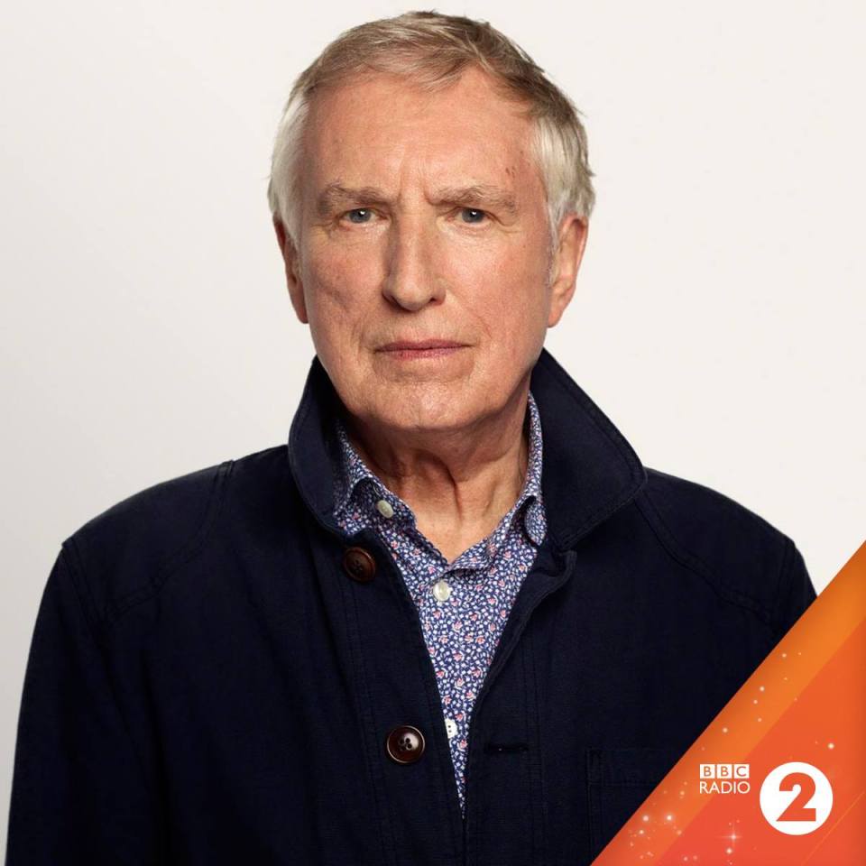 a man with a bbc radio 2 logo behind him