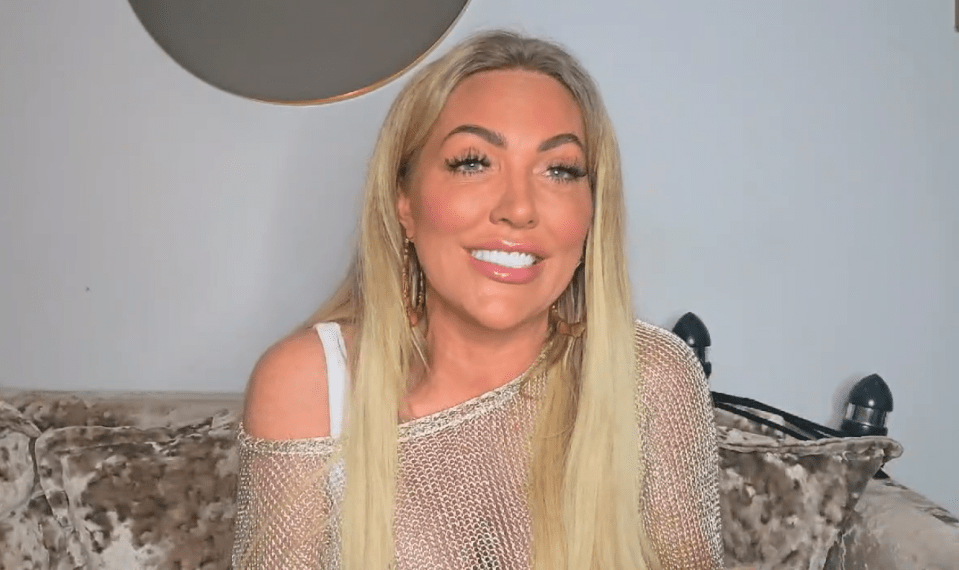 a woman with long blonde hair is smiling for the camera