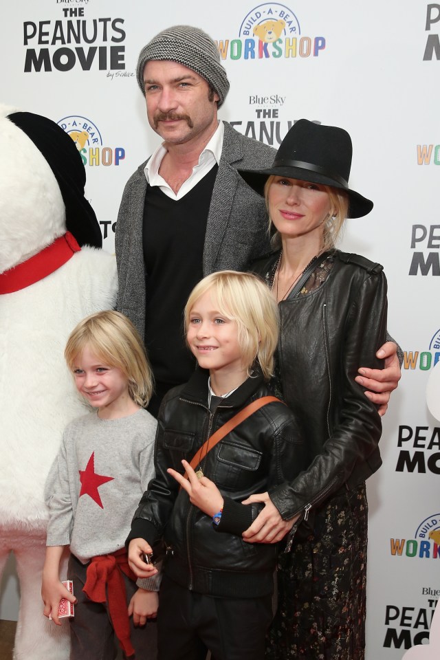 a family poses on the red carpet at the peanuts movie workshop