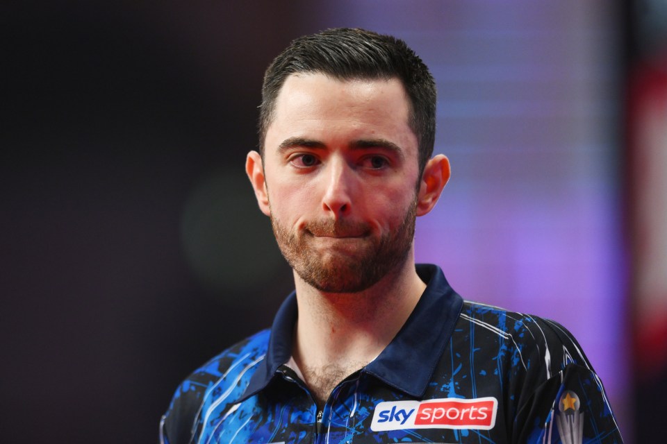 a man wearing a shirt that says sky sports on it