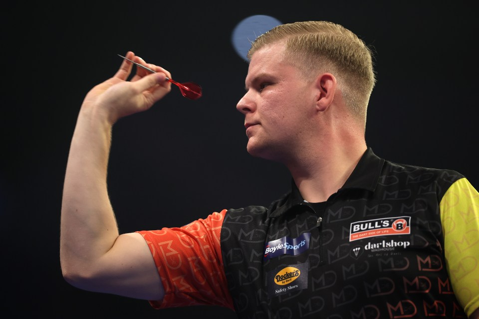 LEICESTER, ENGLAND â OCTOBER 08: Mike De Decker of Belgium throws in his first round match against Damon Heta of Australia during day two of the 2024 BoyleSports World Grand Prix darts at Mattioli Arena on October 08, 2024 in Leicester, England. (Photo by Alex Pantling/Getty Images)