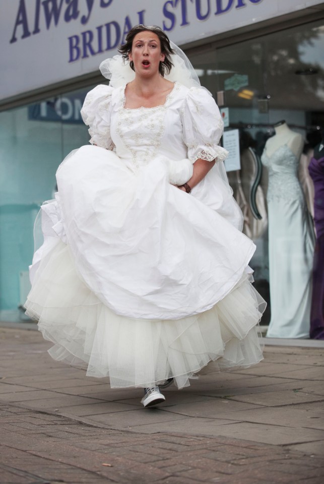 a woman in a wedding dress is running in front of an always bridal studio