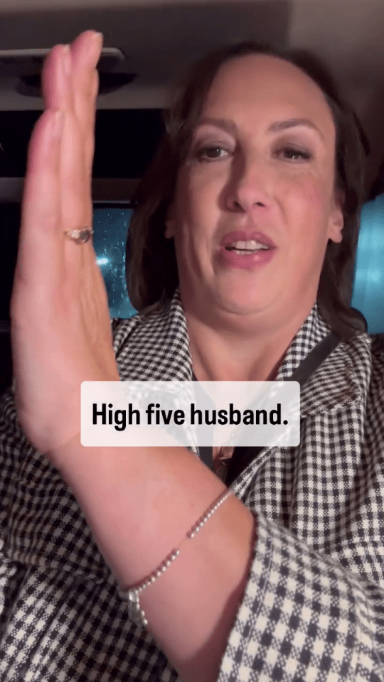 a woman in a plaid jacket says high five husband
