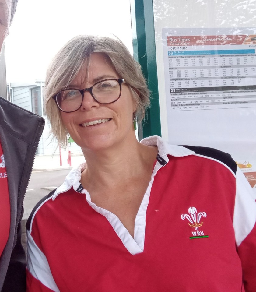 a woman wearing a red and white shirt with the word wru on it