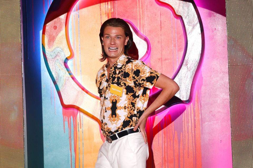 a man wearing a shirt that has the word versace on it