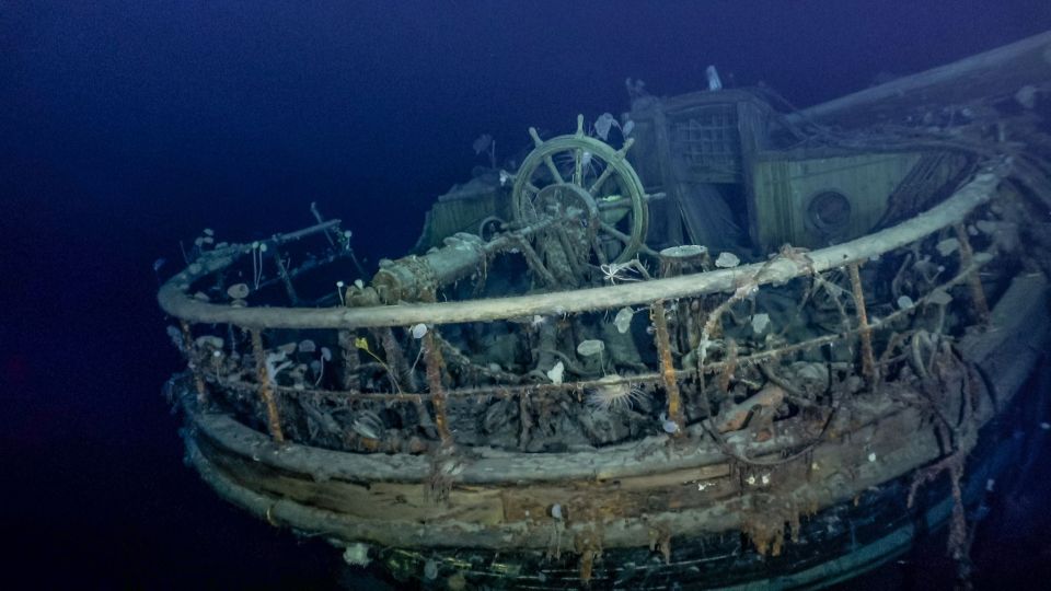 a shipwreck with a steering wheel in the middle of it