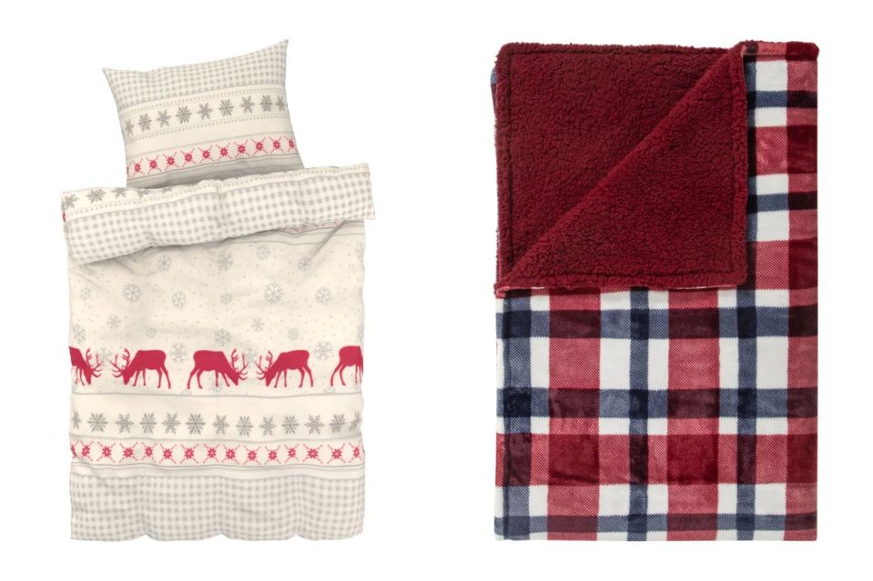 a bedspread with reindeer and snowflakes and a plaid blanket