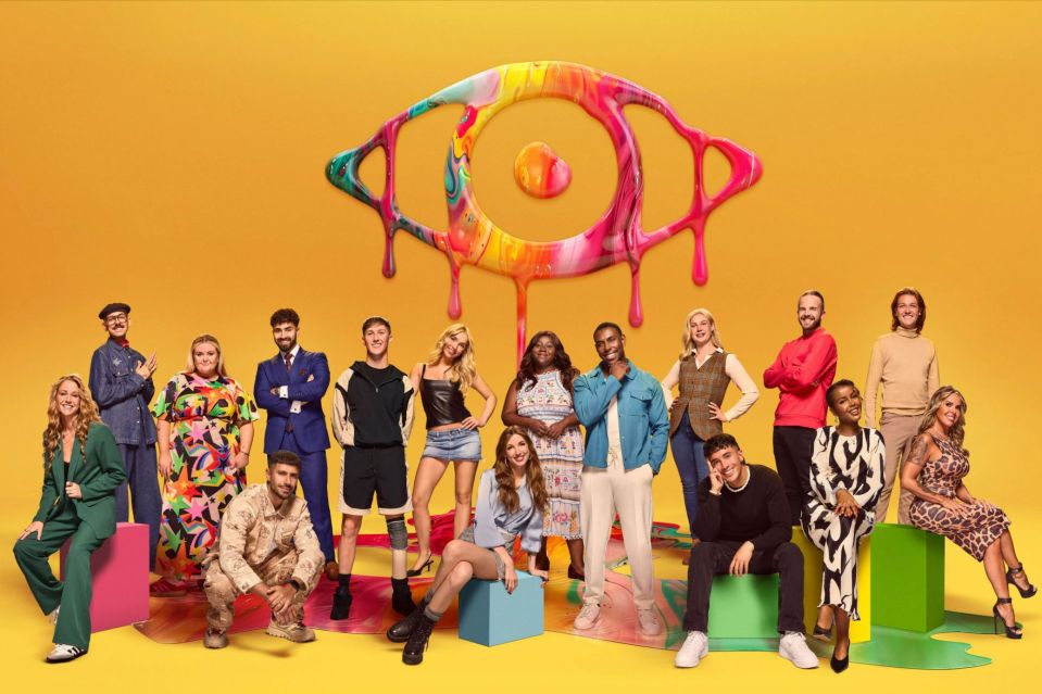 a group of people standing in front of a colorful eye