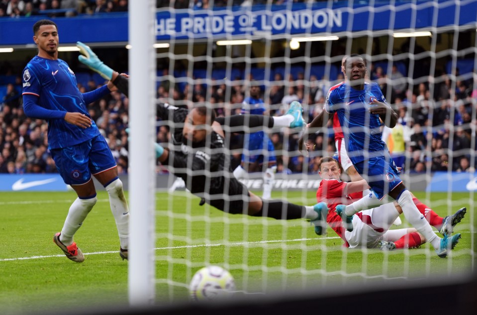 a soccer game is being played in front of a banner that says the pride of london
