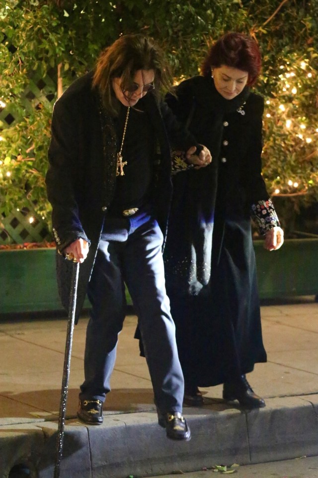 a man with a cane is walking with a woman
