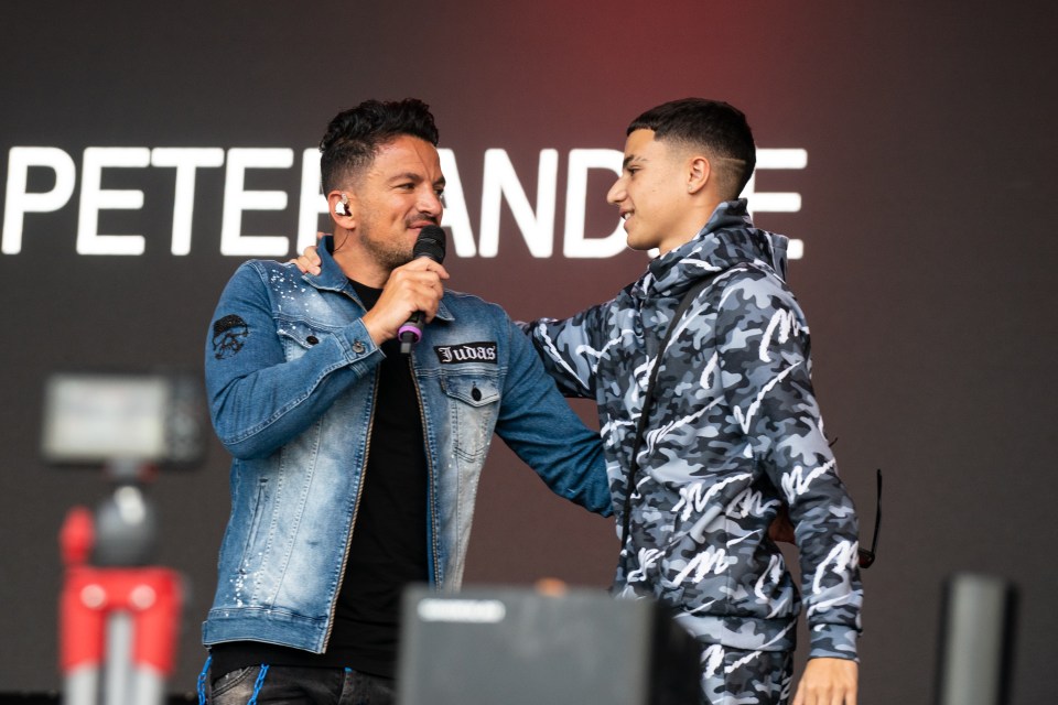 two men standing next to each other with the word peter behind them