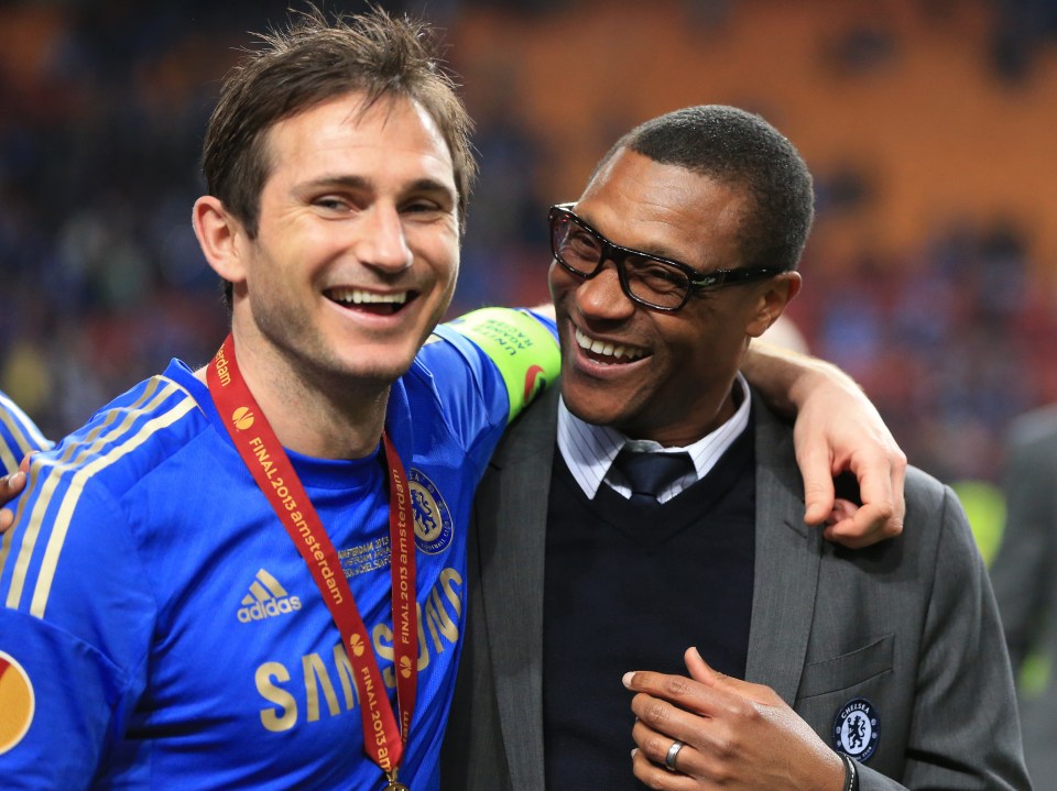 two men are posing for a picture and one has a samsung shirt on