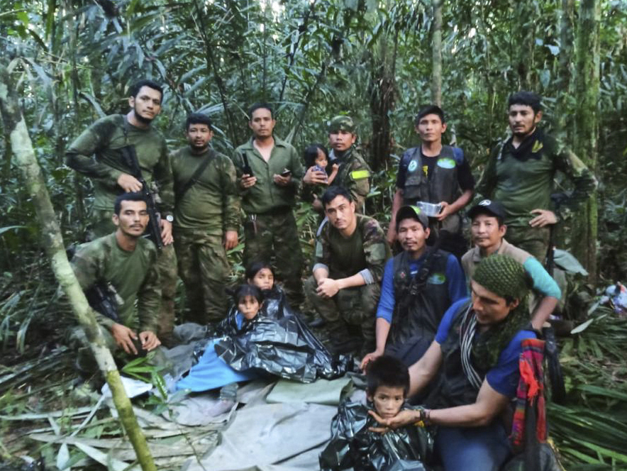a group of soldiers are posing for a picture in the jungle
