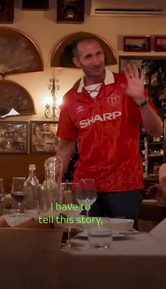 a man in a red shirt that says sharp on it