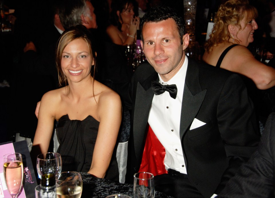 a man in a tuxedo sits next to a woman in a black dress