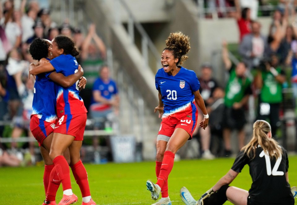 a soccer player with the number 20 on her jersey