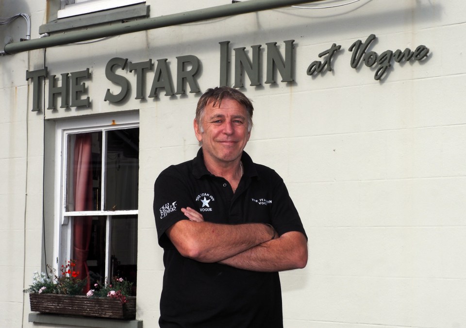 a man stands in front of the star inn at vogue