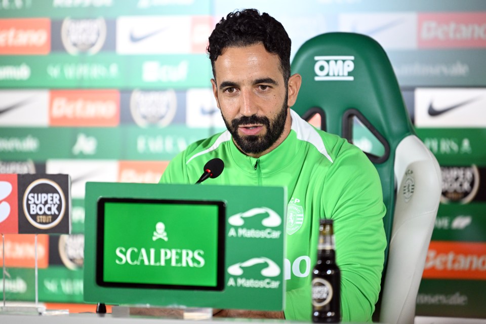 a man sitting in front of a green omp chair