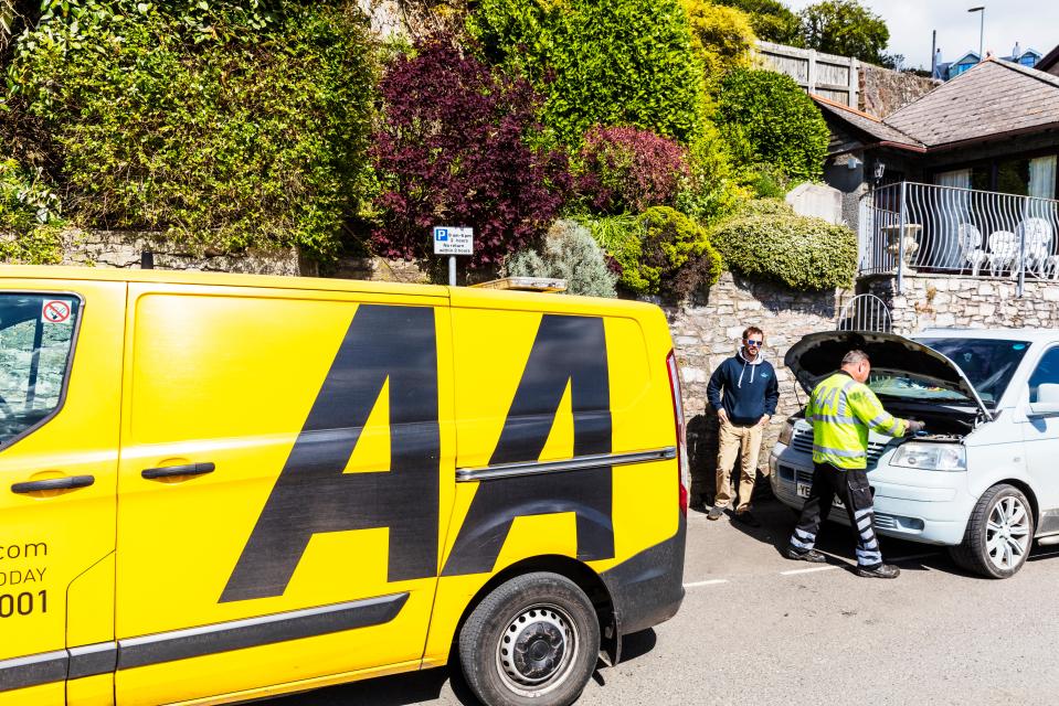 a yellow van with the letter aa on it