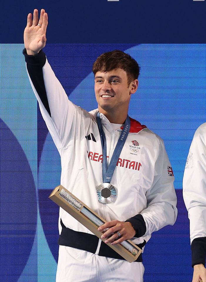 a man wearing a jacket that says britain on it