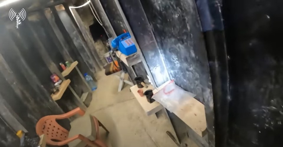 a room with a chair a table and a box that says ' a ' on it