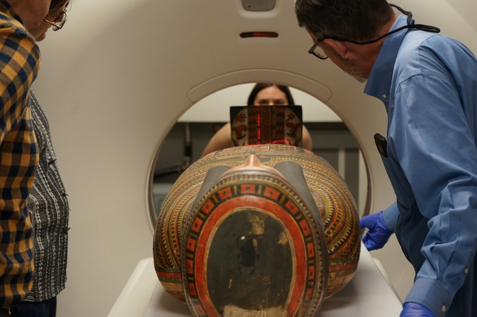 a ct scan of a coffin with a painting on it