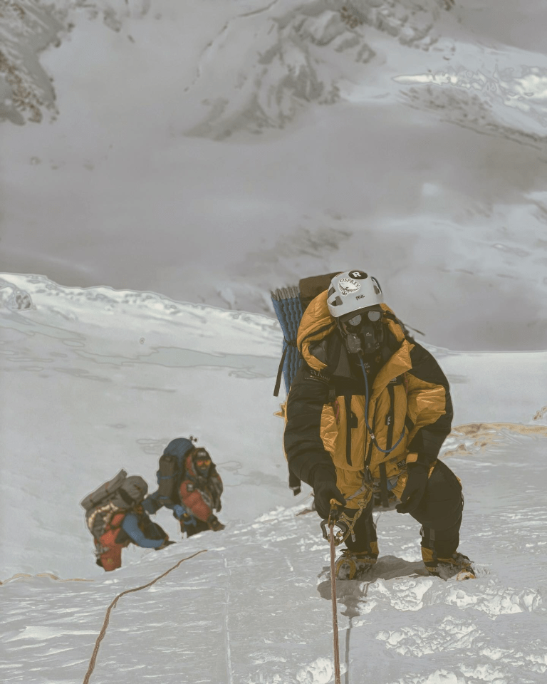 a person wearing a helmet that says petzl on it