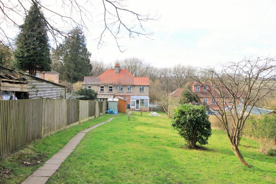 The disputed fence between the semi-detached properties of Mark and Louise Coates (right) and Brian Greenwood and Janice Turner (left) as it was in 2015