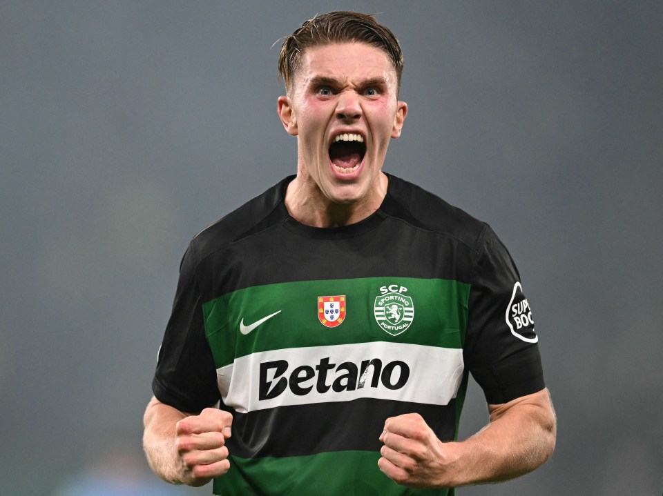 a soccer player wearing a betano jersey celebrates