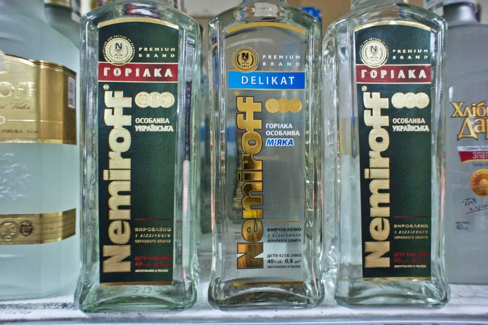 three bottles of nemiroff sit on a shelf