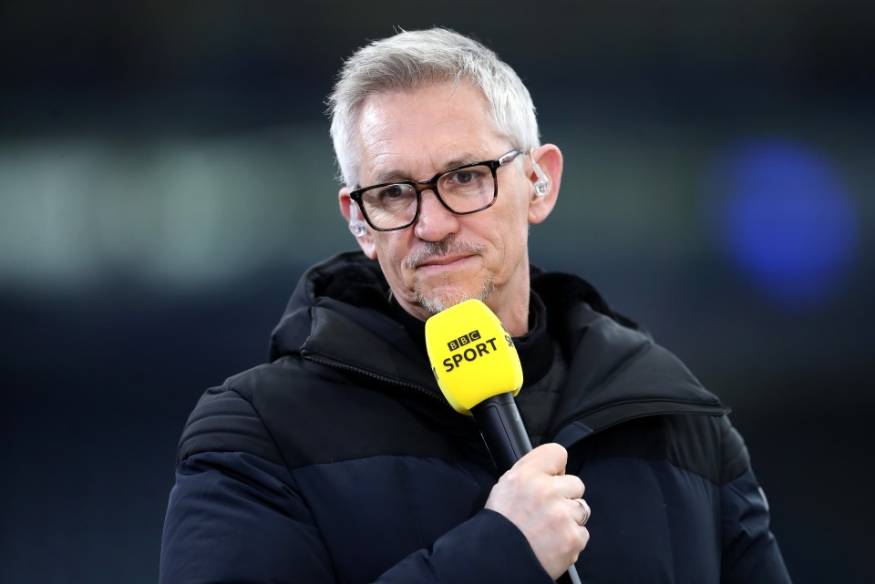 a man holding a yellow bbc sport microphone