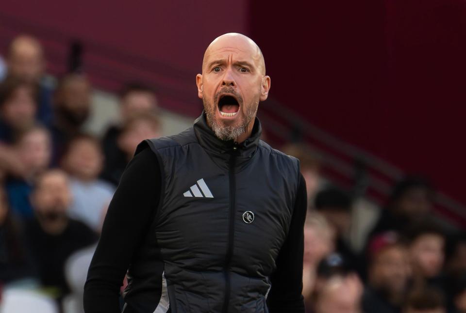 a bald man with a beard wears an adidas vest