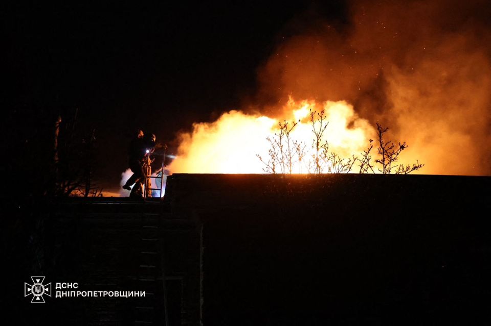 Firefighters working to put out a blaze in Dnipro, Ukraine, on Thursday