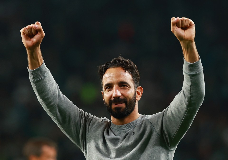 a man with a beard is raising his fist in the air