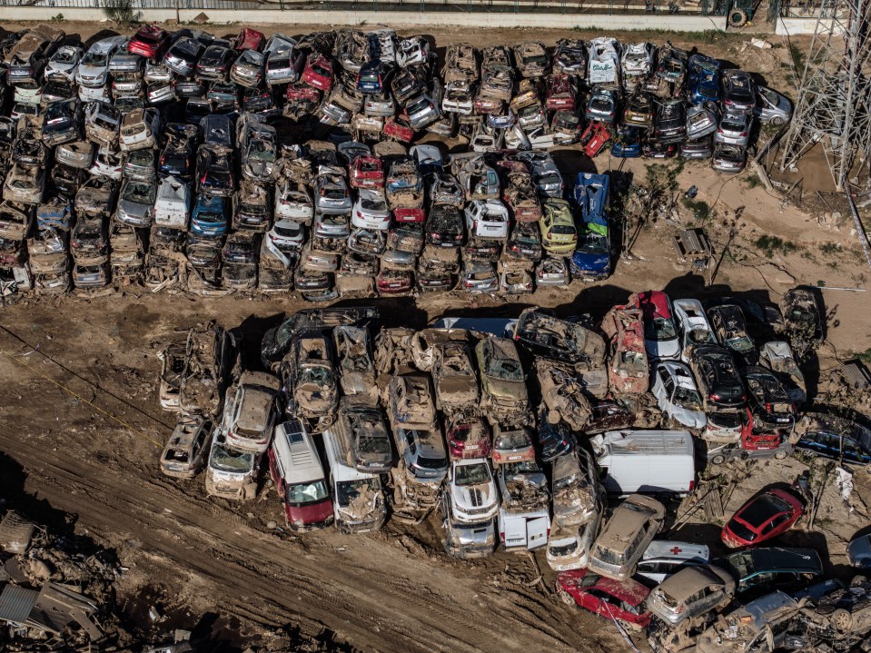 a bunch of cars are stacked on top of each other