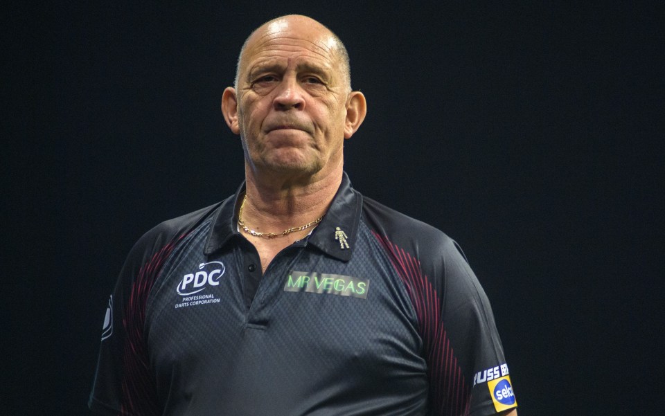 a man wearing a shirt that says pdc on it