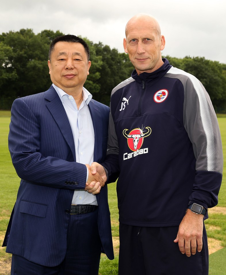 two men shaking hands with one wearing a jacket that says cardiac