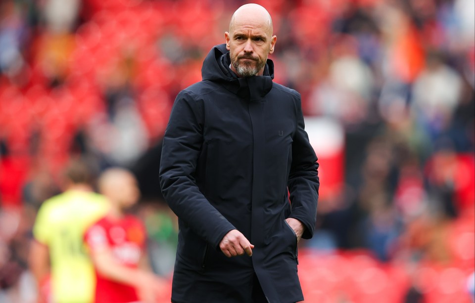 a bald man with a beard wearing a black jacket