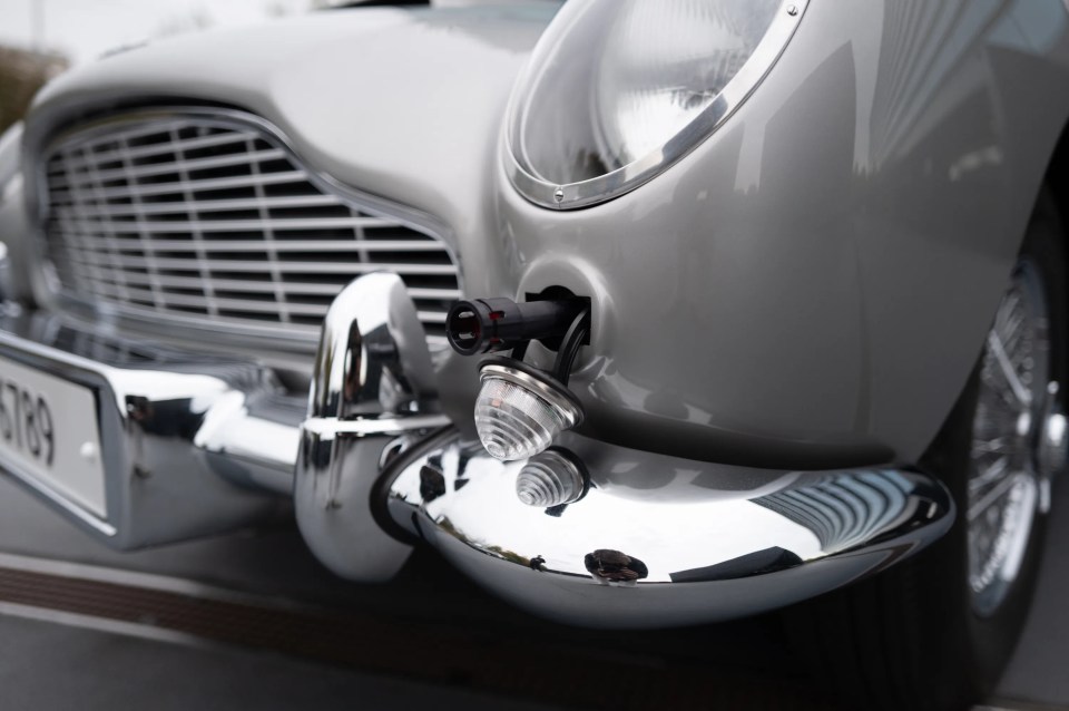 a silver car with a license plate that says jtr9