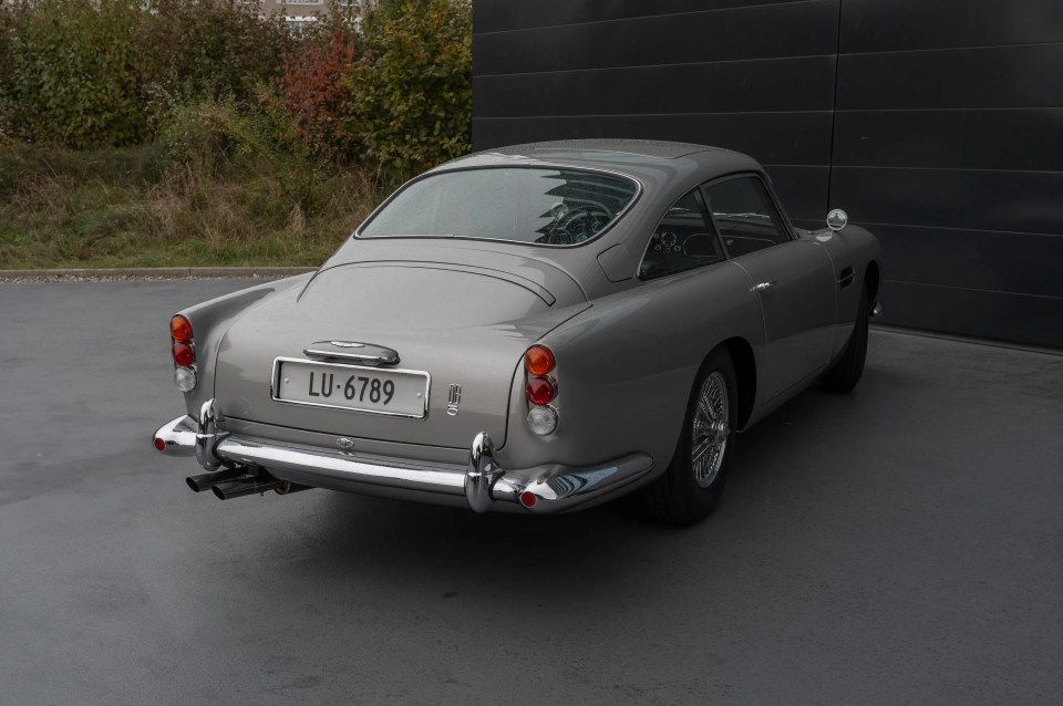 a silver car with a license plate that says lu-6789