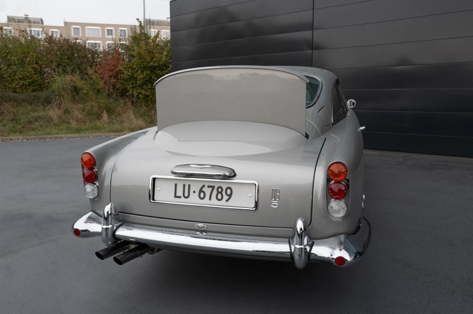 a silver car with a license plate that says lu-6789