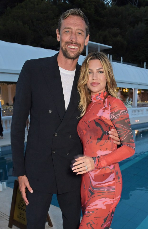 peter crouch and abbey clancy pose for a photo