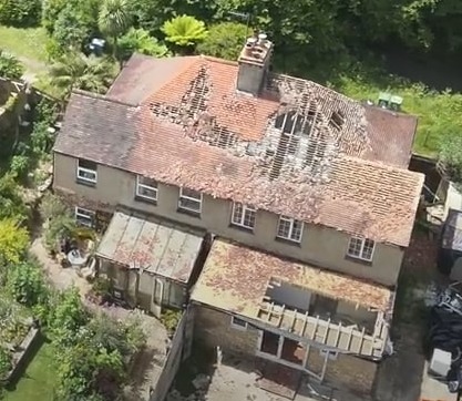 Drone footage shows the extent of damage to the roof of the semi-detached property