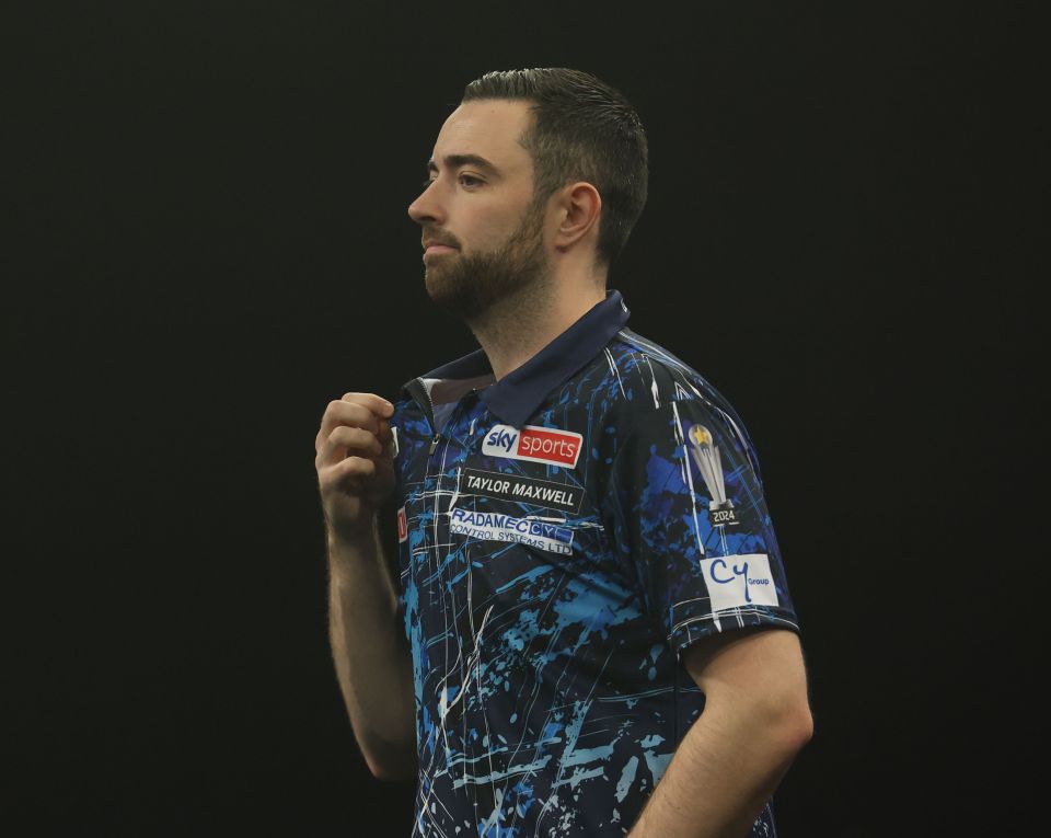 a man wearing a shirt that says sky sports on it