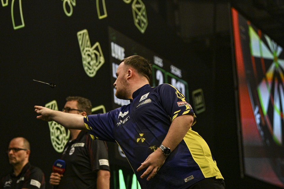 a man in a blue and yellow shirt with the word trust on it