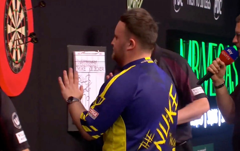 a man in a blue and yellow shirt with the word nike on the back